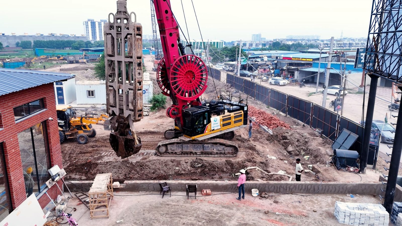 Diaphragm wall rig operating along the site edge